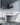 White Cast Iron Freestanding Tub with Riveted Metal Skirt